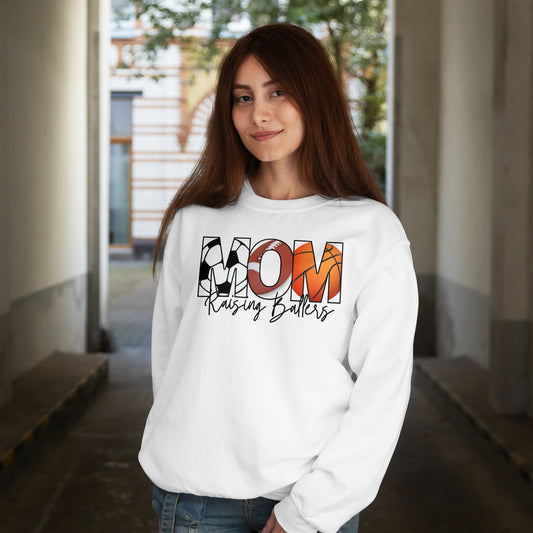 Woman wearing a white sweatshirt with colorful text design in an indoor setting